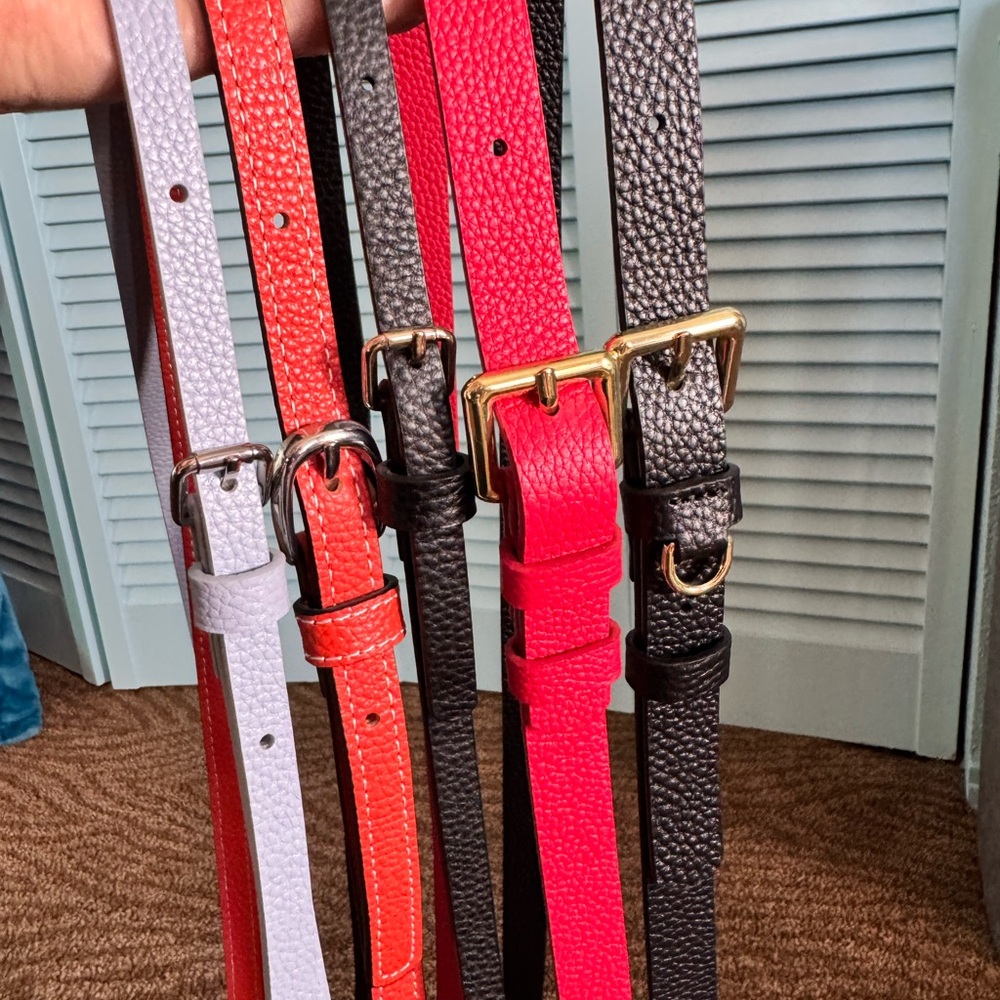Bandolier authentic red,black,blue and orange leather straps.